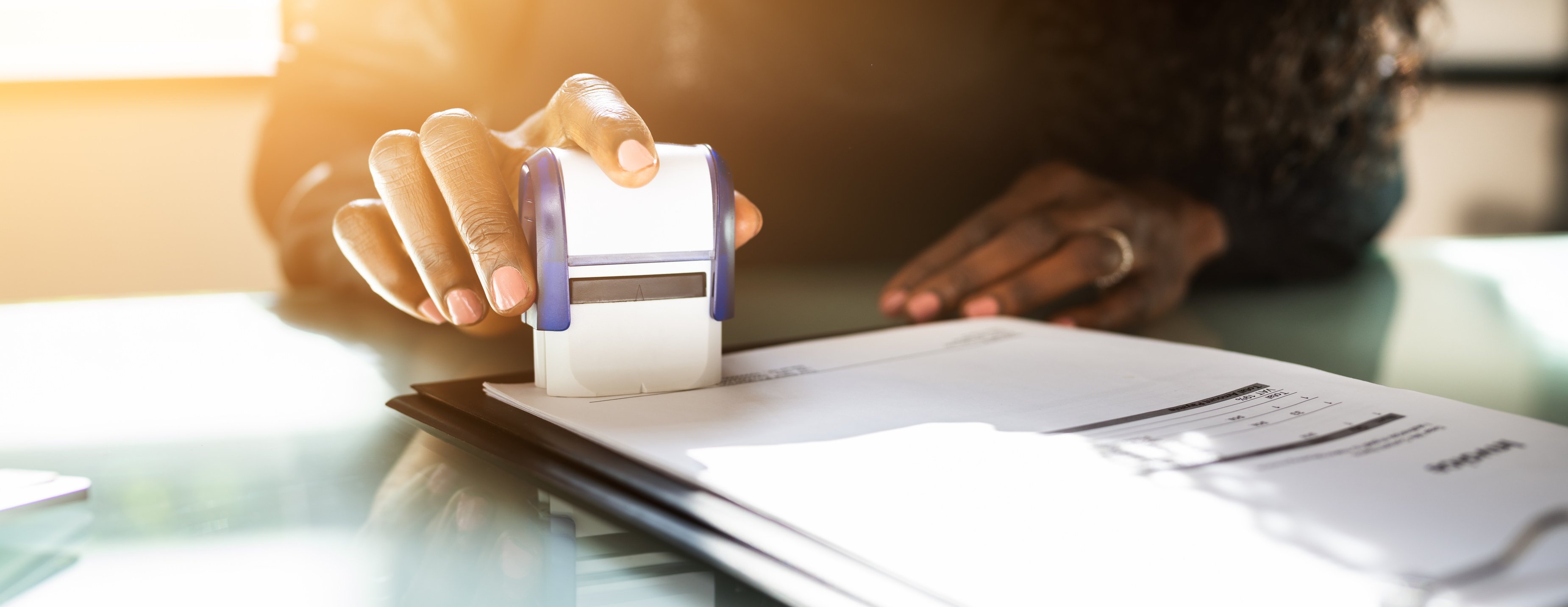 African American Black Woman Using Notary Stamp